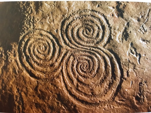 Newgrange triple spiral motif